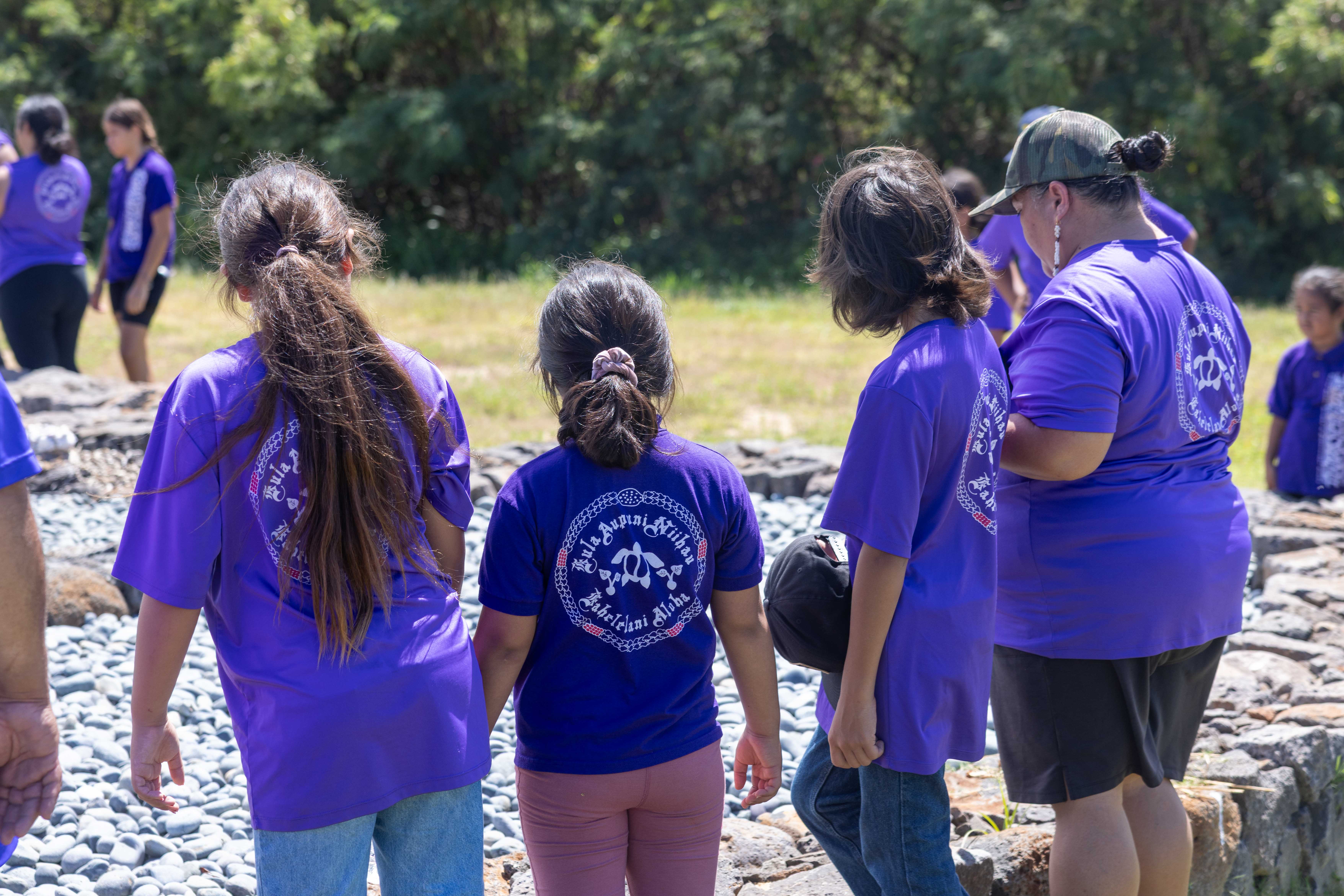 Teachers and staff prepare Kawaikini students for a team-building beach cleanup activity at Waiapua‘a Bay.